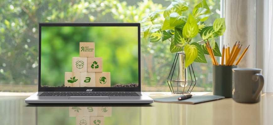 Notebook Acer Aspire Go 15 (AG15-72P-54G8) modrý Pracovný stôl s notebookom Acer Aspire Go 15 s logami udržateľnosti na obrazovke