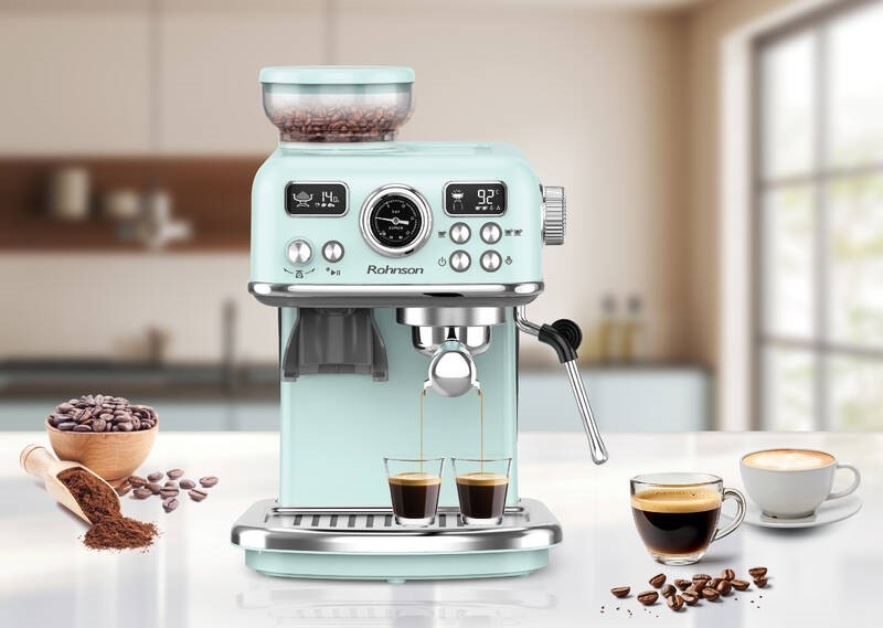Pákový kávovar Rohnson R-98250G 2v1 svetlo modrá Elegantný pákový kávovar Rohnson R-98250G 2v1, ktorý práve pripravuje súčasne dve kávy, vedľa neho je postavená šálka s cappuccinom a ako dekorácia je obrázok doplnený kávovými zrnami aj namletou kávou.