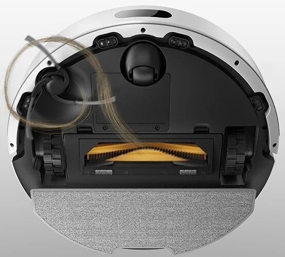 Robotický vysávač Dreame F20 biely Na robotický vysávač Dreame F20 sa pozeráme zospodu - zobrazenie špeciálnych zubov zabraňujúce zamotávaniu vlasov do hlavnej kefy.