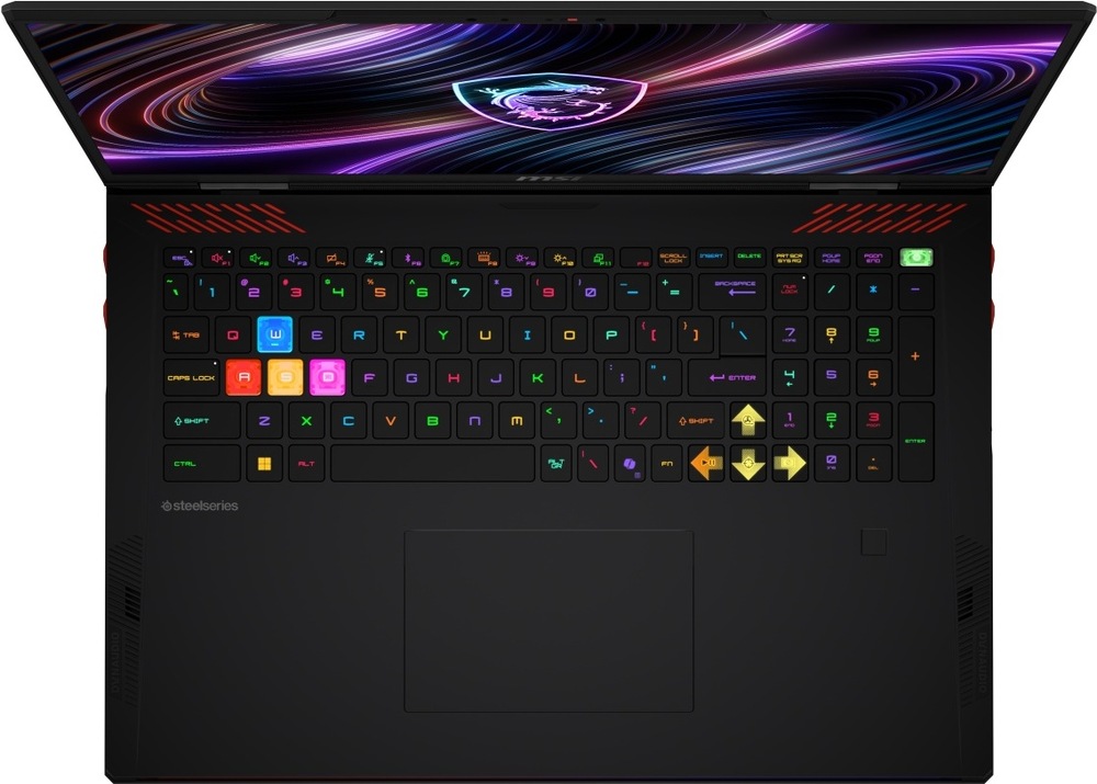 Notebook MSI Raider 18 Max HX A2WI-1042CZ čierny Pohľad zhora na otvorený herný laptop Raider 18 Max HX A2W s RGB s podsvietenou klávesnicou a veľkým touchpadom