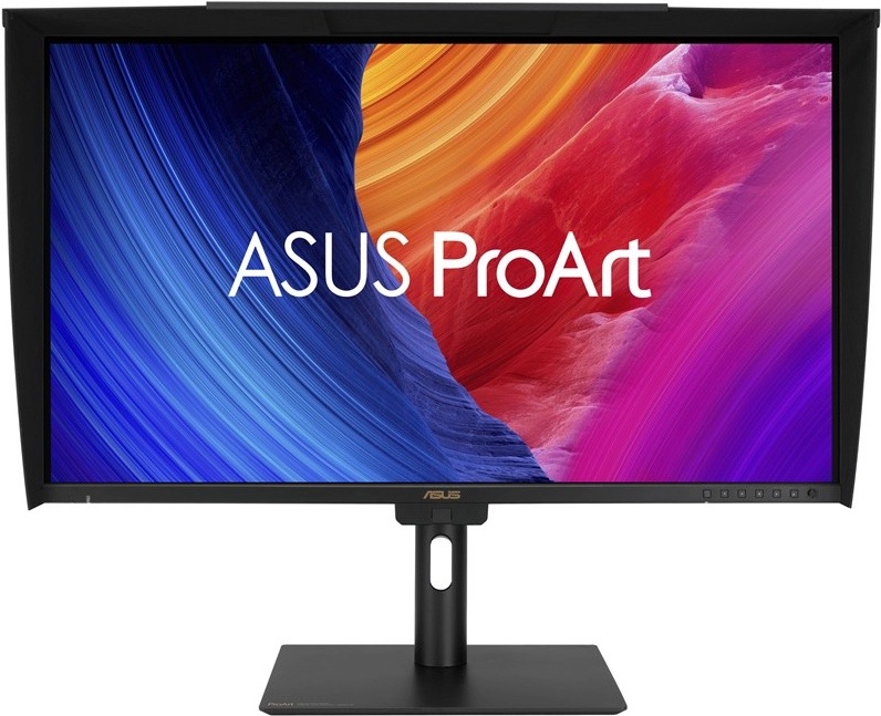 Na obrázku je monitor Asus ProArt PA27UCGE 27" z čelného pohľadu. Monitor má čierny stojan s plochou základňou a otvor v stĺpiku pre vedenie káblov. Displej je doplnený o čiernu tieniacu clonu po stranách a hore, ktorá pomáha obmedziť odlesky pri práci s obrazom. Na obrazovke je farebná. fialových tónoch. Vpravo dole na spodnom rámčeku sú vidieť ovládacie tlačidlá monitora.
