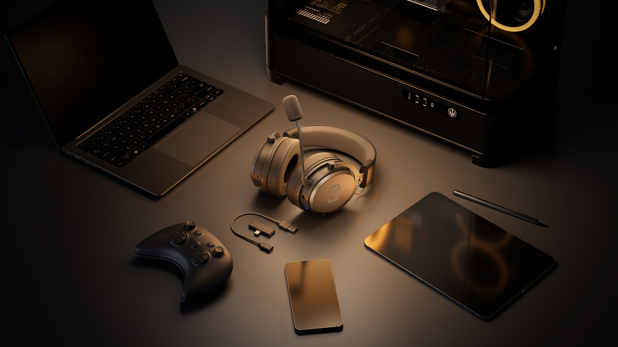 Headset ENDORFY VIRO Wireless Alt Grey sivý ENDORFY VIRO Wireless Alt Grey položený na stole vedľa notebooku, tabletu, telefónu, herného ovládača a bezdrôtového adaptéra