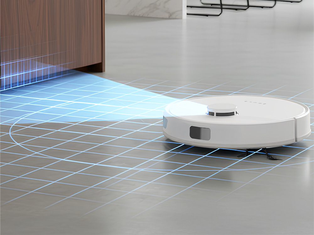 Robotický vysávač Tesla RoboStar iQ660 Plus biely Robotický vysávač Tesla RoboStar iQ660 Plus stojí na zemi pri skrinke a mapuje priestor na upratovanie, čo je znázornené modrým svetlom a modrou mriežkou na podlahe