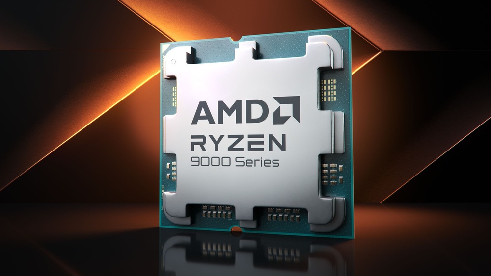 Herný počítač Lynx Ultimate Ryzen 7 čierny Čip AMD Ryzen radu 9000 na tmavom geometrickom pozadí s oranžovými akcentmi. Kovový povrch čipu odráža svetlo a vyjadruje pokročilú technológiu.