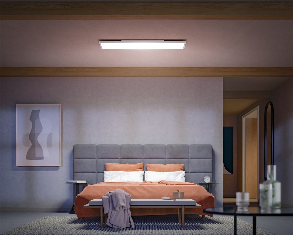 LED stropné svietidlo Philips Surimu Hue Panel, 60W, 120x30 cm, White and Color Ambiance biele Pohľad na obývaciu izbu nasvetlený osvetlením Philips Surimu Hue s bielym teplým svetlom