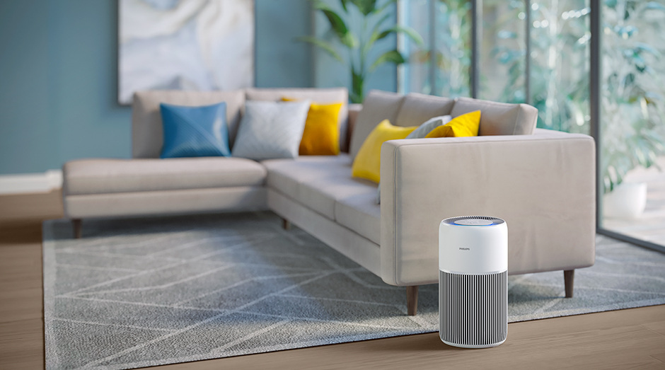 Čistička vzduchu Philips AC2220/10 2000 Series stojaca v obývacej izbe vedľa pohovky
