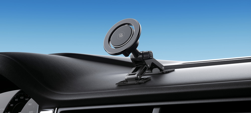 Držiak na mobil GoGEN MCH504, s podporou MagSafe čierny Magnetický držiak na mobil do auta GoGEN MCH504, pripevnený na palubnej doske nad volantom. Držiak má nastaviteľné rameno a čiernu magnetickú plochu na upevnenie telefónu