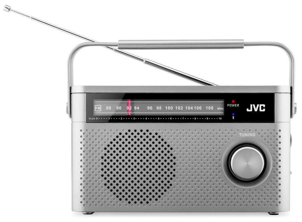 Rádioprijímač JVC RA-E315G sivý Čelný pohľad na šedé rádio JVC RA-E315G s analógovým ladením a strieborným otočným gombíkom. Na prednej strane je prehľadná stupnica FM frekvencií, logo JVC a LED indikátor napájania aj Bluetooth. Hornú časť dopĺňa strieborno-čierne madlo