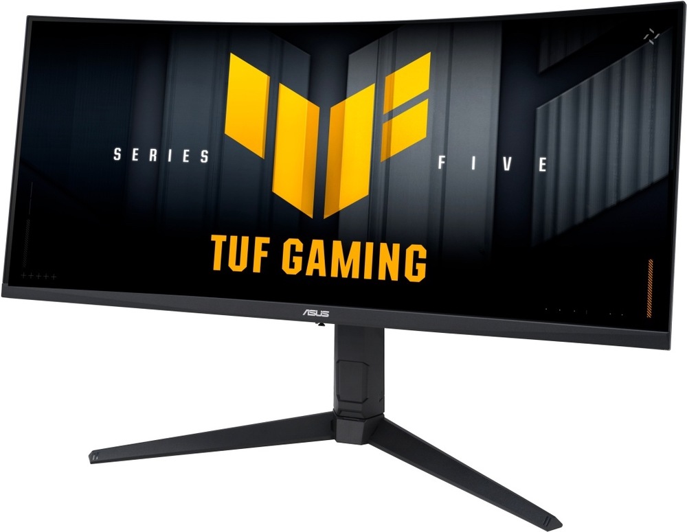 Herný monitor Asus TUF Gaming VG34WQML5A čierny Na obrázku je herný monitor Asus TUF Gaming VG34WQML5A 34" z predného šikmého pohľadu. Monitor má širokouhlú prehnutú obrazovku s tenkými rámčekmi a čierne prevedenie. Stojí na stabilnom hernom stojane s tromi štíhlymi nohami. Na displeji je tmavá grafika s veľkým žltom GAMING.