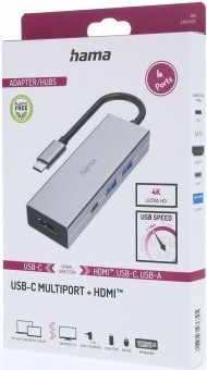 Na obrázku je krabička od USB-C hubu Hama Multiport. Na prednej strane obalu je vyfotený samotný šedý húb s krátkym USB-C káblom. Ďalej sú tam výrazné popisky a ikony, ktoré upozorňujú na 4 porty, podporu 4K Ultra HD a vysokú prenosovú rýchlosť. V dolnej časti je názov produktu USB-C Multiport + HDMI. Obal pôsobí čisto, prehľadne a jasne ukazuje, na čo zariadenie slúži.
