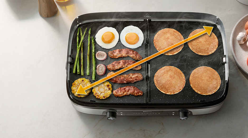 Množstvo jedla pripravujúce sa na veľkej ploche grilu Philips HD6222/90