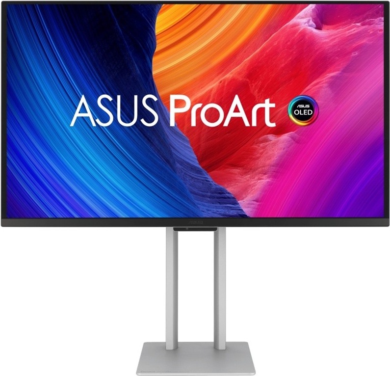 Na obrázku je monitor Asus ProArt OLED PA27UCDMR s uhlopriečkou 27". Je zobrazený z čelného pohľadu na striebornom stojane s hranatou základňou. Displej má tenký čierny rámček a na obrazovke je farebná grafika s nápisom ASUS ProArt a označenie OLED. Obraz kombinuje výrazné modré monitora na prácu s obrazom, grafikou a presnými farbami.