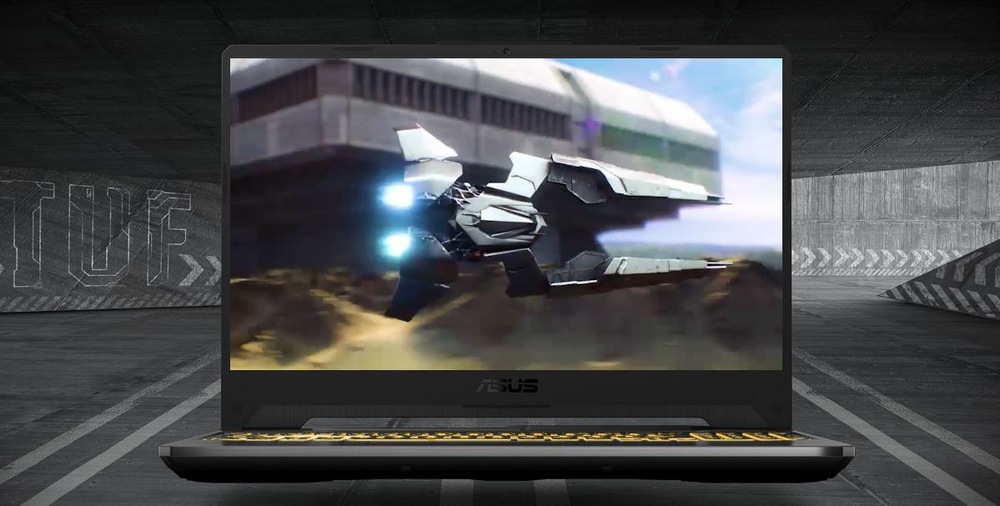 Notebook Asus TUF Gaming A15 čierny Na obrazovke tmavého herného notebooku ASUS TUF sa vznáša elegantný futuristický lietajúci stroj.