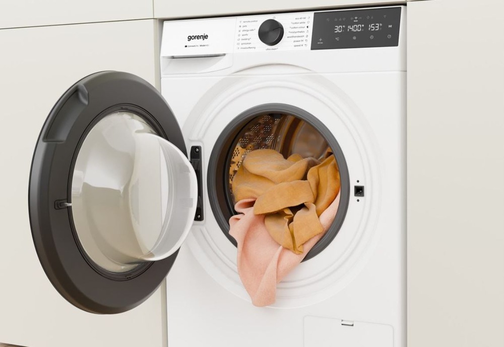 Práčka Gorenje G400 WG494A11 UltraClean biela otvorená práčka Gorenje UltraClean s oranžovou vypadávajúcou bielizňou. Práčka je zabudovaná do skrinovej steny