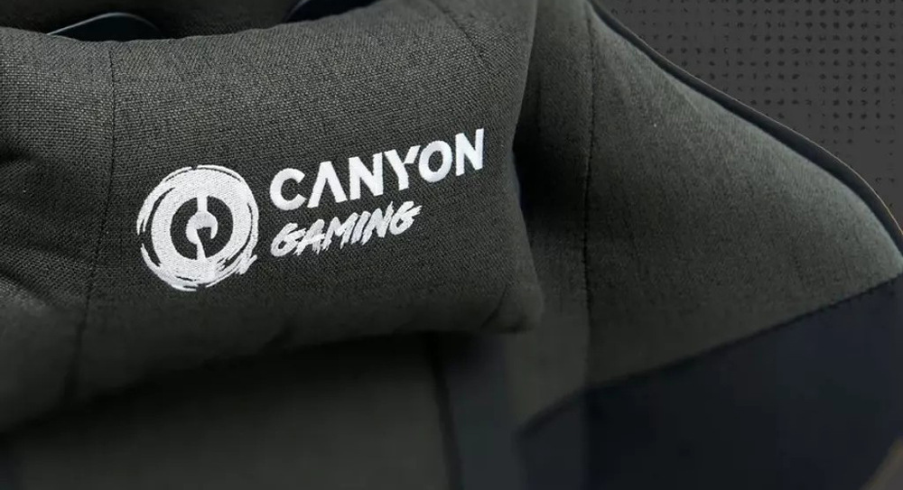 Herná stolička Canyon Crest Fabric sivá Na správne držanie tela poslúži pri stoličke Canyon Crest Fabric dodávaná bedrová a hlavová opierka