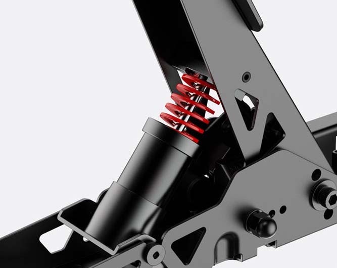 Detailný záber čierneho mechanického odpruženia s jasne červenou vinutou pružinou. Dizajn je elegantný a industriálny a vyžaruje odolnosť a pevnosť.