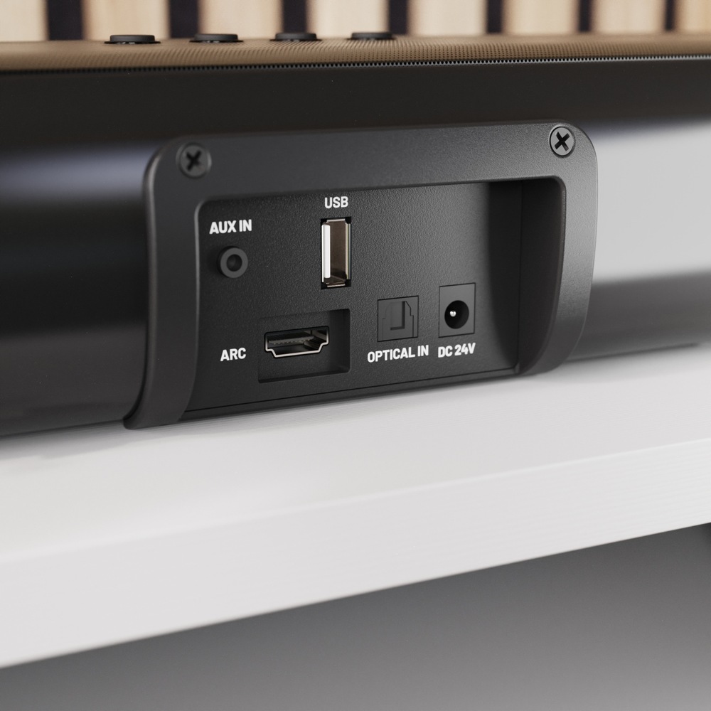 Zadné konektory soundbaru: AUX, USB, HDMI ARC, optický vstup a napájanie.