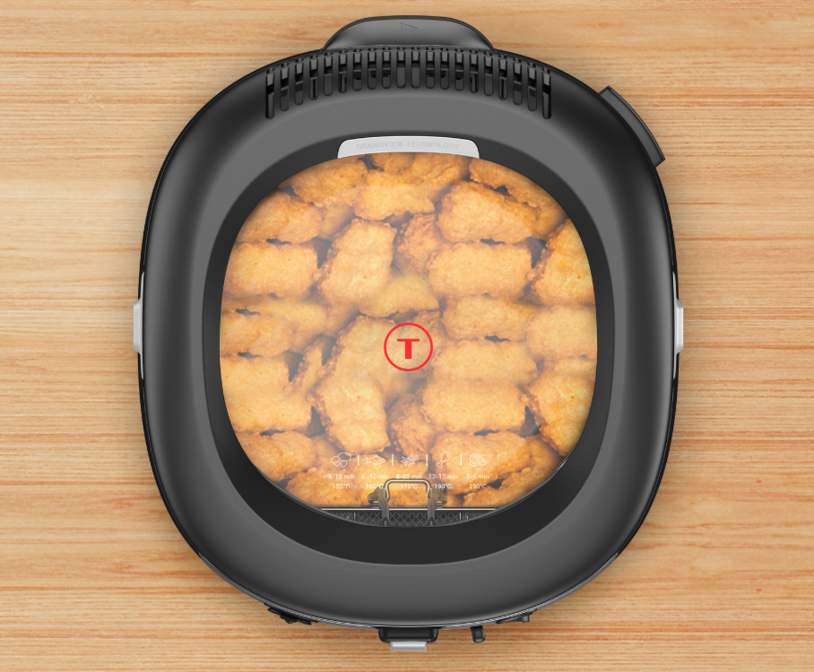 Fritéza Tefal Filtra Vision+ FF2588E0 čierna/strieborná detail Fritézy Tefal Filtra Vision+ FF2588E0 poukazujúci na vyprážanie kuracích nugetiek