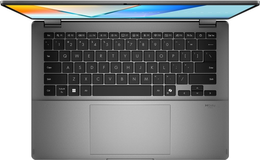Pohľad zhora na klávesnici notebooku s priestranným touchpadom