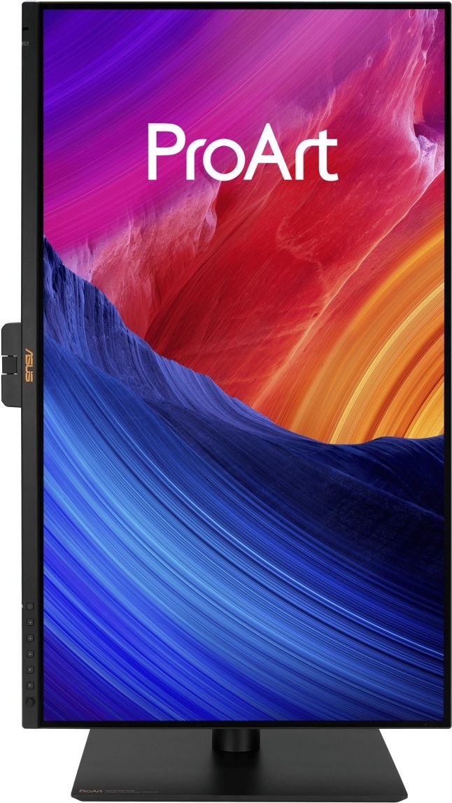 Monitor Asus ProArt PA27UCGE čierny Na obrázku je monitor Asus ProArt PA27UCGE 27" otočený na výšku v režime pivot. Displej stojí na čiernom stojane s plochou základňou a zobrazuje farebnú grafiku ProArt v modrých, červených, fialových a oranžových tónoch. Na ľavom spodnom rámčeku sú vidieť ovládacie tlačidlá a na ľavej strane čiastočne vystupuje. zvislej polohe, napríklad na úpravu fotografií, grafiku alebo dlhšie dokumenty.