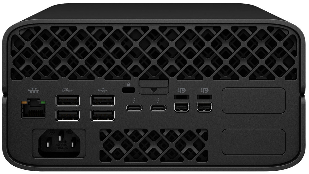 PC mini HP Z2 Mini G1a čierny Na obrázku je zadná strana kompaktného stolného počítača HP Z2 Mini G1a AMD Ryzeň AI Max + PRO 395 v čiernom prevedení. Horná časť zaberá výrazná ventilačná mriežka s geometrickým vzorom. Vľavo je sieťový port, vedľa niekoľko USB portov, dva USB-C konektory a dva obrazové výstupy DisplayPort. Uprostred hore je aj zámok a malé tlačidlo alebo poistka. Dole vľavo je konektor pre napájací kábel a uprostred ďalší vetrací otvor. Zadný panel pôsobí prehľadne, technicky a ponúka bohatú konektivitu.