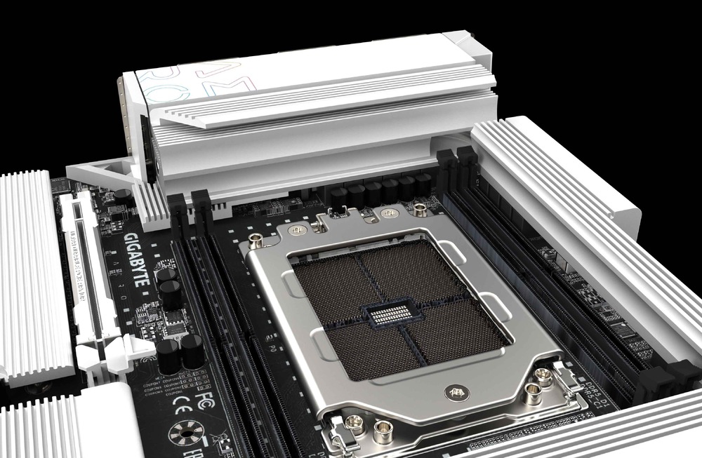 Základná doska GIGABYTE TRX50 AERO D Detail základnej dosky Gigabyte s veľkou striebornou päticou procesora obklopenou chladiacimi rebrami a komponentmi, umiestnenou na čiernom pozadí.