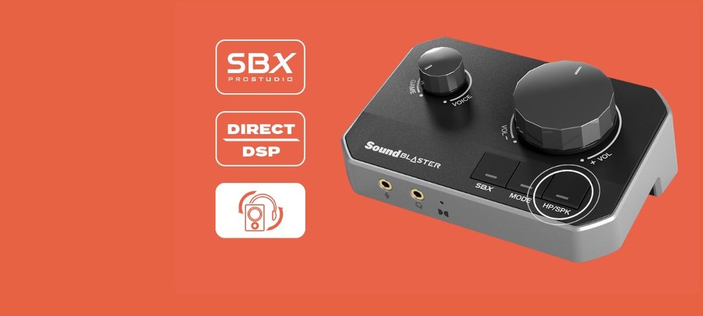 Zvuková karta Creative Sound Blaster G8 čierna Záber na prevodník Sound Blaster G8 na oranžovom pozadí so zdôraznenými funkciami SBX, Direct DSP a rýchlym prepínaním zvukových zdrojov.