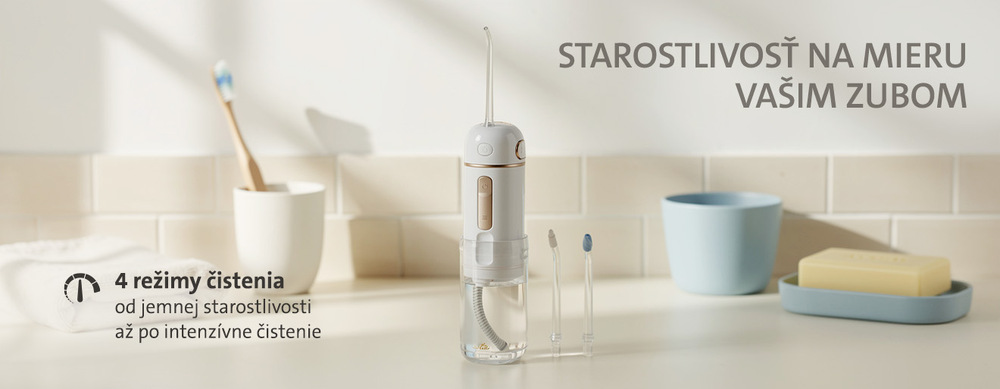 Detailný pohľad na elegantné bielo-zlaté telo cestovnej ústnej sprchy ETA Aqua Care Compact s ovládacími tlačidlami a zvislým textom modelu na prednej strane