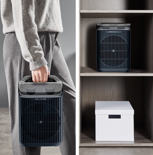 Žena prenáša teplovzdušný ventilátor Rowenta SO6551F0 Intense Comfort Aqua do šatne na uloženie