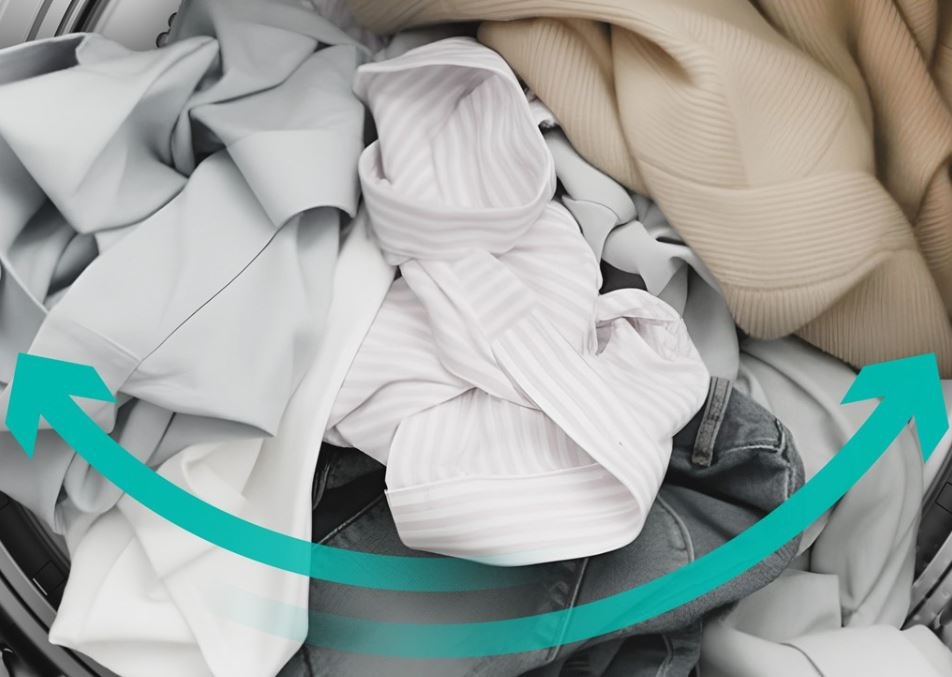 Sušička bielizne Gorenje G400 DG48D NatureDry čierna znázornenie pohybu bubna sušičky, šípky ukazujú zmenu smeru tam a späť. Vnútri bubna je veľa bielizne
