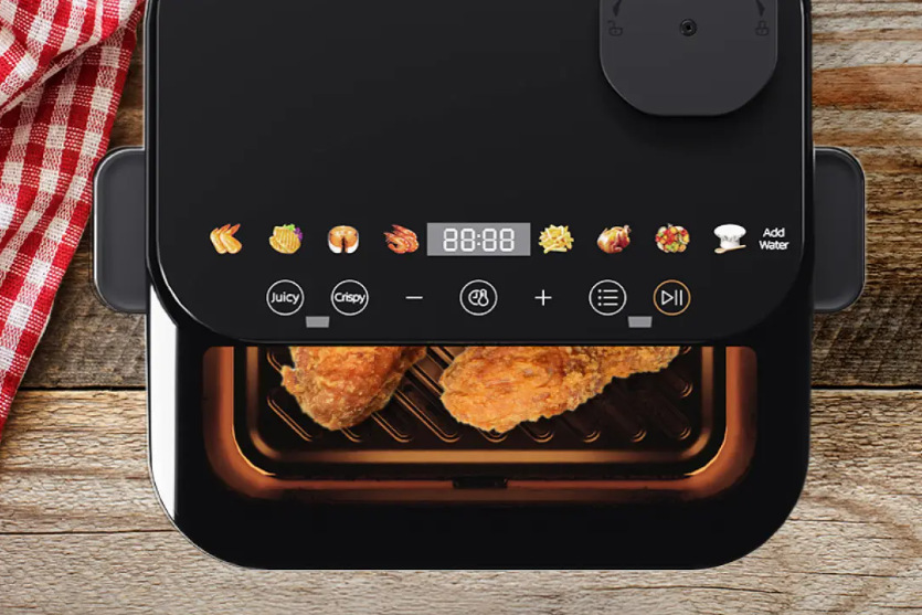 Fritéza teplovzdušná Midea CY75C2 čierna Fritéza teplovzdušná Midea CY75C2 s kuracími stehienkami vo vnútri