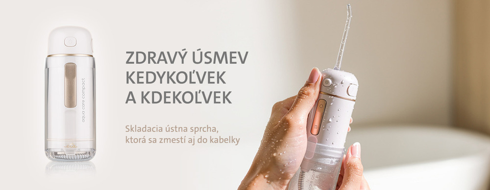 Detailný pohľad na bielo-zlaté telo cestovnej ústnej sprchy ETA Aqua Care Compact s odklopeným krytom, ku ktorému sa pripája moderný USB-C nabíjací kábel