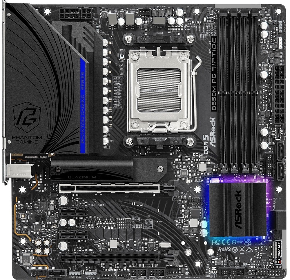 Základná doska ASRock B650M PG Riptide Pohľad zhora na základnú dosku. Sú tu 4 sloty pre DDR5 pamäte, slot pre procesor, grafiku, chladič, bočný panel s portami pre externé zariadenia.